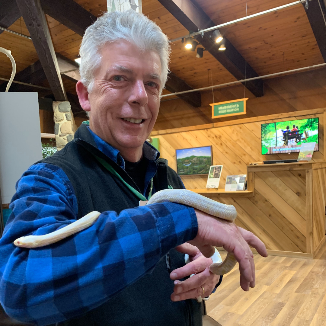 Photo of naturalist with a snake